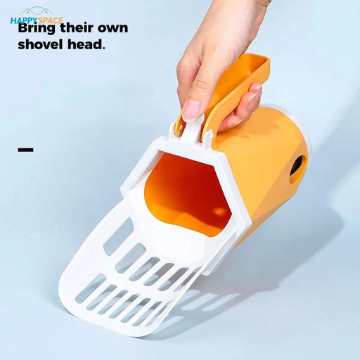 Orange colored cat litter scooper with slits/holes for cat litter box