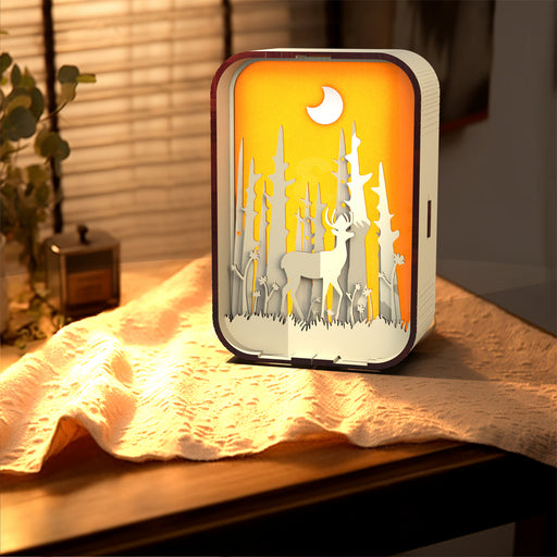 wood carved 3D night light with deer, trees, and moon